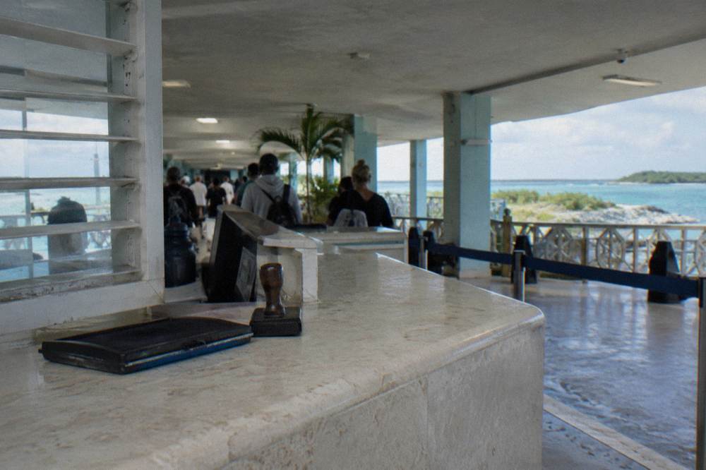 Immigration desk counter in a small bright airport terminal