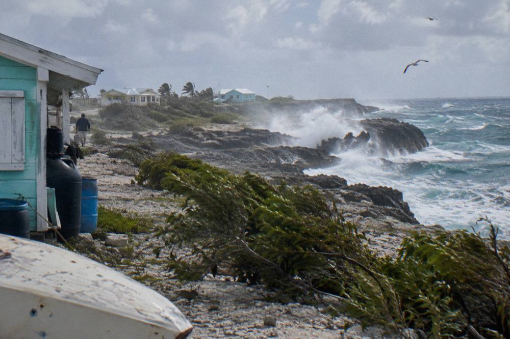 Rocky Atlantic shoreline with waves breaking against limestone formations on the east coast of Great Exuma