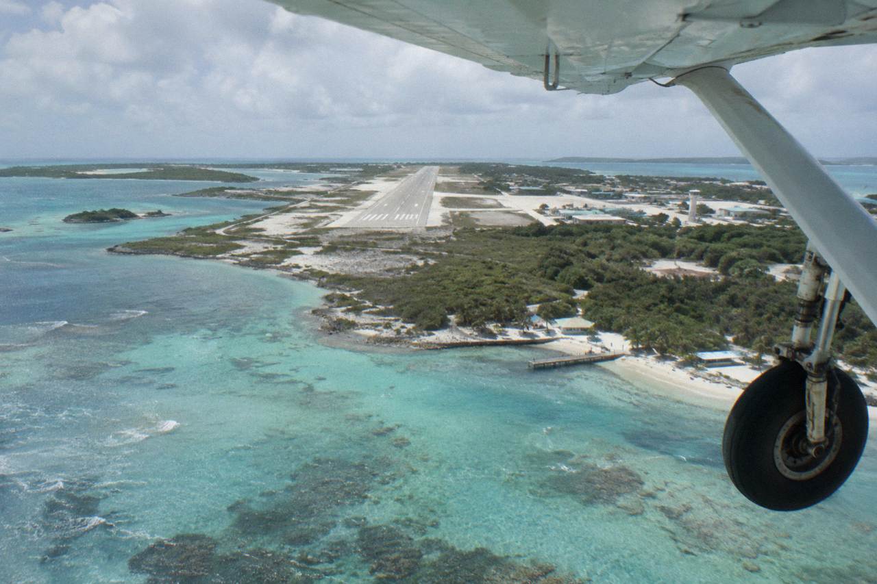 Turquoise shallows of the Exuma cays seen from a low-flying light aircraft