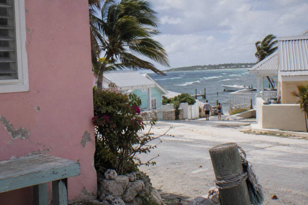 Pastel colonial buildings along a sunny Nassau street near the harbour